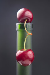 fresh cherry berry with on a green bottle. healthy food for breakfast. fruits of vegetation. fruit dessert