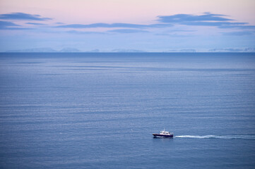 Sticker - Lonely boat floating in sea water at sundown