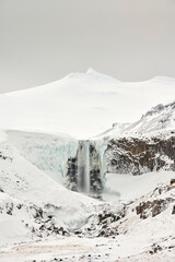 Sticker - Waterfall near snowy mountain in nature