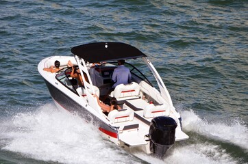 Wall Mural - Group cruising on Biscayne Bay in a high-end runabout motorboat.