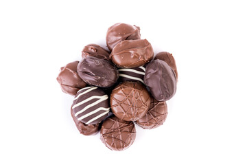 Wall Mural - Ten pieces of milk and dark striped chocolates in a pile top down view