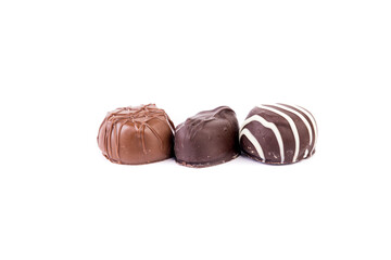 Sticker - Three delicious chocolates in a row isolated over white