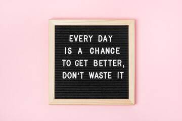 Wall Mural - Every day is a chance to get better, don't waste it. Motivational quote on black letter board on pink background. Concept inspirational quote of the day. Greeting card, postcard