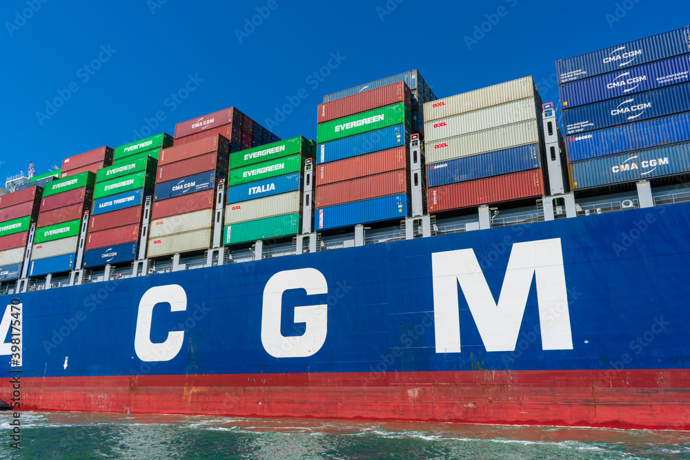Colorful cargo shipping containers stacked aboard of French container ...