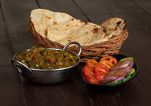 Indian Cuisine Bhindi Masala On Wooden Background