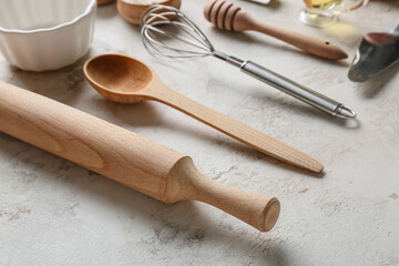 Set of kitchen utensils for bakery on grey background