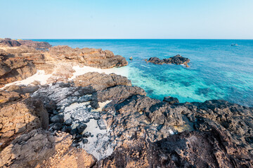 Wall Mural - Be island ( small island, Bo Bai island ) with local colorful basket boats at Ly Son island, Quang Ngai Province, Viet Nam