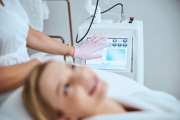 Doctor preparing her client for a cosmetic procedure