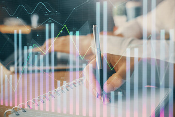 Double exposure of forex chart drawing over people taking notes background. Concept of financial analysis