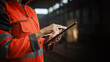 © Gorodenkoff - Close Up on Hands of a Professional Female Heavy Industry Engineer Wearing Safety Uniform and Using Tablet Computer. Industrial Specialist Standing in a Metal Construction Manufacture.