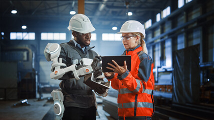Poster - Futuristic Concept of a Manual Labor Worker in a Bionic Exoskeleton Prototype Working in a Factory. Heavy Industry Engineer Monitors the Powered Suit on an African American Assistant.