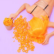 © Porechenskaya - Fast Food creative concept. Minimal art. Girl  sleep in corn cheese rings. Home party disco fashion style