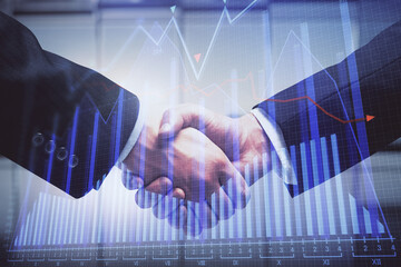 Double exposure of forex graph hologram and handshake of two men. Stock market concept.