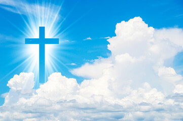 Christian cross appears bright in the sky background