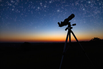 Wall Mural - Silhouette of a astronomy telescope with twilight sky.