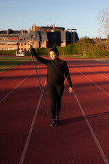 Wall Mural - young sportsman on the running track