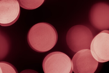 Pink bokeh is used as a background in Christmas. Valentine, New Year and other festivals