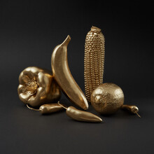 Creative Composition From Gold Vegetables.