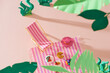 © Maki Company Limited/Stocksy - Picnic background with beach chair, fruits, hat on the beach
