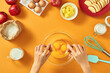 © Maki Company Limited/Stocksy - Woman hands breaking an egg to separate egg white and yolks and egg shells at the background