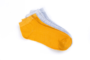 two pairs of colored short socks on a white background, top view