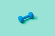 © Yaroslav Danylchenko/Stocksy - Sport equipment blue barbell.