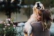 © Samantha Gehrmann/Stocksy - woman hugging a dog
