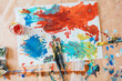 © Marc Bordons/Stocksy - A kid and this father painting at home