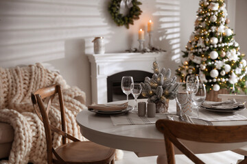 Poster - Festive table setting and beautiful Christmas decor in living room. Interior design