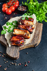 ribs grilled BBQ spices tomato sauce piece of meat second course snack ready to eat on the table meal snack top view copy space for text food background rustic