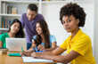 © Daniel Ernst - Beautiful afro american female student with group of multi ethnic students