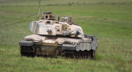 Action shot of a British army Challenger 2 FV4034 main battle tank on military exercise, Salisbury Plain UK