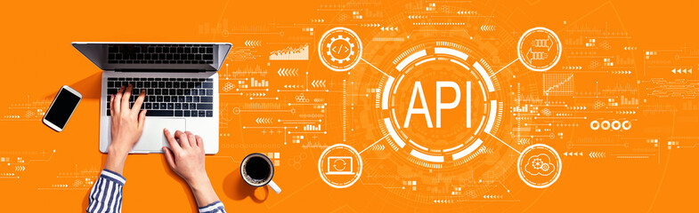API - application programming interface concept with person using a laptop computer