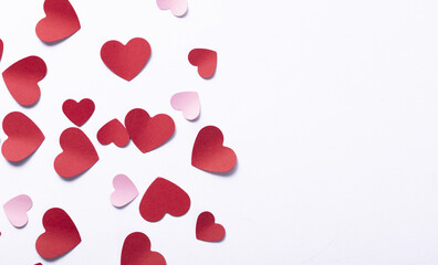 Sticker - Top view of red paper Valentine hearts on  a white background