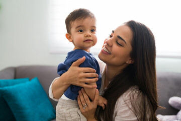 loving mother with cute son at home