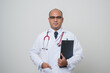 © Chanakon - Physician in white coat, stethoscope holding clipboard to beside arm and.look into camera isolated on white background.