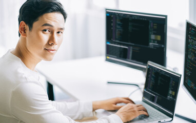 Asian male programmers are developing security software for computer systems
