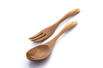 Close up wooden fork and spoon on white