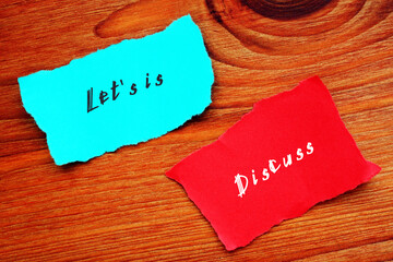 Business concept about Let's is Discuss with sign on the page.