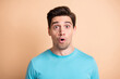 © deagreez - Close-up portrait of nice attractive stunned guy sudden news reaction isolated over beige pastel color background