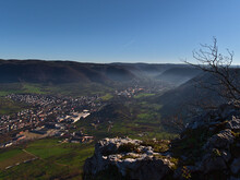 Beautiful Panoramic View Of Valley With Two Villages Unterlenningen And Lenningen, Baden-Wuerttemberg, Germany On Foothills Of Swabian Alb With Hazy Morning Air In Late Autumn. Rock In Foreground.