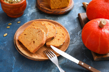 Tasty pumpkin pie on color background