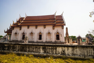 Beautiful old Buddhist temple in Thailand, blue sky.