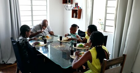 Canvas Print - Black African family eating lunch together