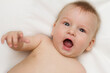 © lika_vayzek - Portrait of a cute 4 months baby lying down on a blanket.