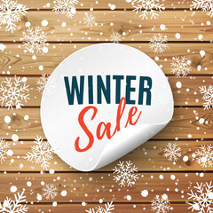 Sticker - Winter sale round banner. Price tag on wooden background with snow and snowflakes. Promotion badge.