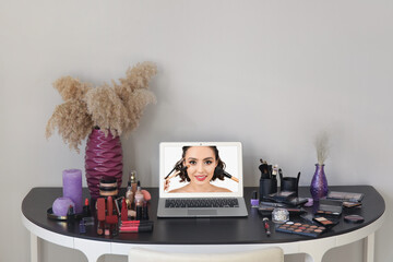 Wall Mural - Workplace of professional makeup artist with modern laptop