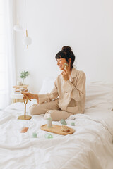 Wall Mural - woman using beauty products at home
