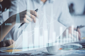 Double exposure of forex graph drawing over people taking notes background. Concept of financial analysis