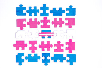 Transgender concept. Blue pink and white colored puzzle isolated on white background. Concept of equality, acceptance of sexual minorities lesbian, gay, bisexual, transgender